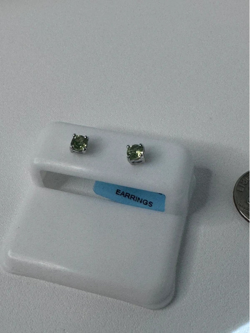 Genuine natural peridot .48 ct, stamped 925